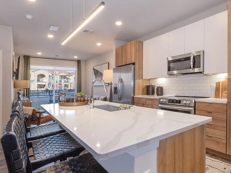 Kitchen with Stainless Steel Appliances and Quartz Countertops
