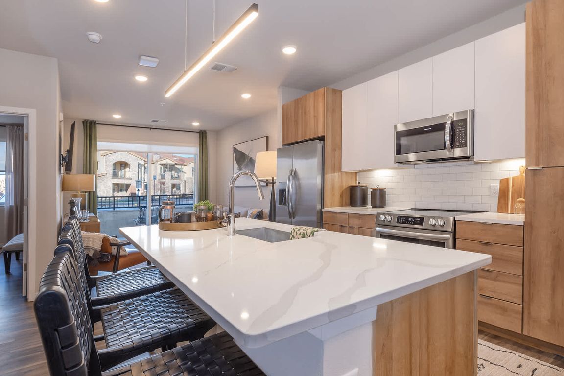 Kitchen with Stainless Steel Appliances and Quartz Countertops