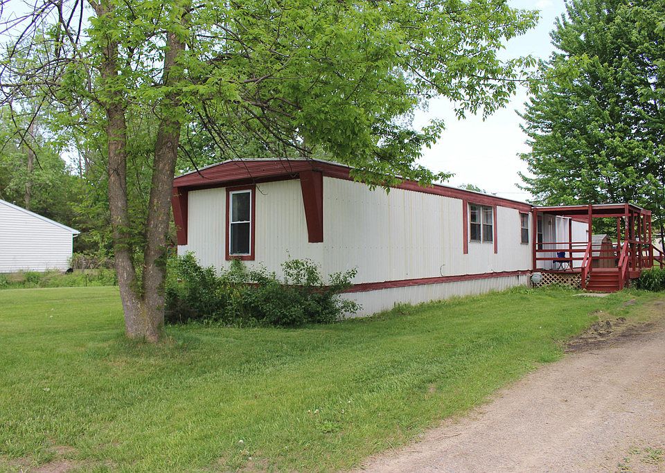 Great option for snowbirds or perfect starter home! Affordable, updated mobile home on large lot wit