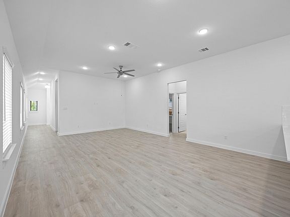 Living Room in the Pecan II home plan by Trophy Signature Homes - REPRESENTATIVE PHOTO