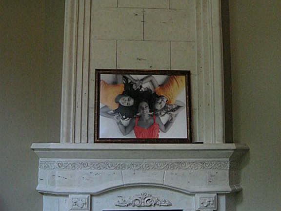 The focal point in the living room is the large, two story high cast stone fireplace.