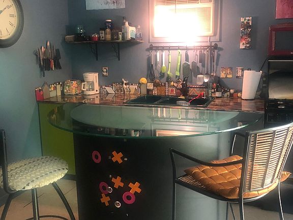 Looking at the kitchen area from the glass counter.