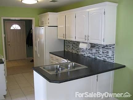 Kitchen
						:
						Updated countertops, glass tile backsplash, bay window with eat in nook