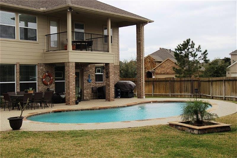 Imagine your own backyard oasis! Relax in the pool on a hot summer day or enjoy the view from the ba