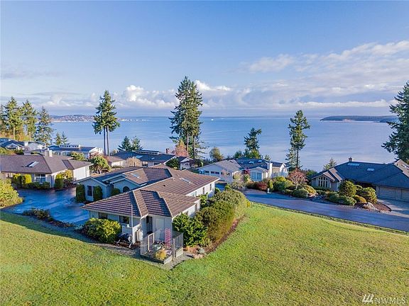 The home is oriented towards the magnificent water & mountain views.  Port Townsend is seen on the left, Indian & Marrowstone Islands on the right.  