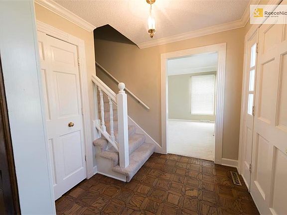 Wood floor entry with coat closet.  All new paint - including trim!