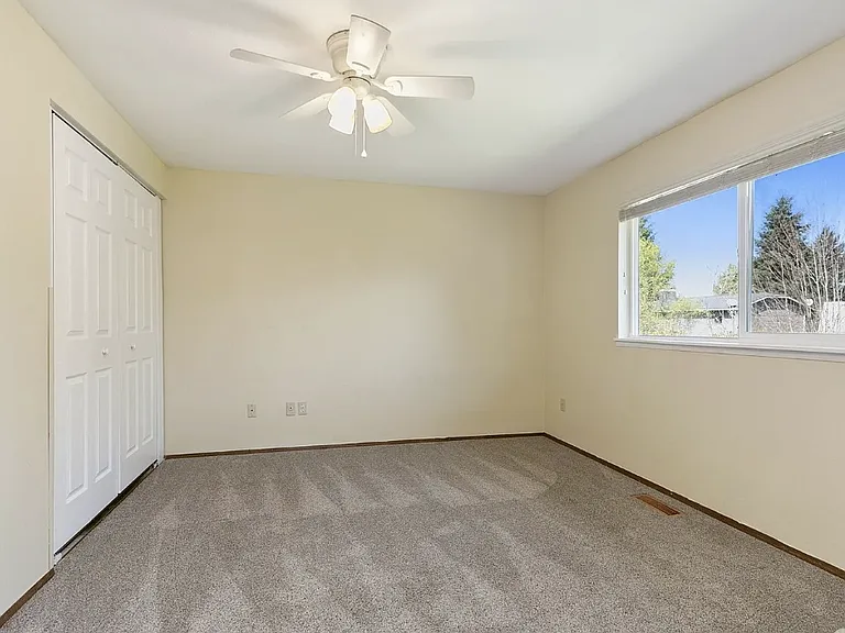 Available bedroom on the upper level, about 140 SQFT with double closets.