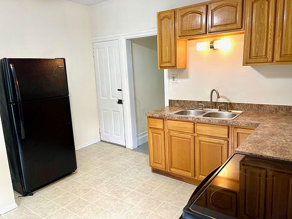 Kitchen with refrigerator.