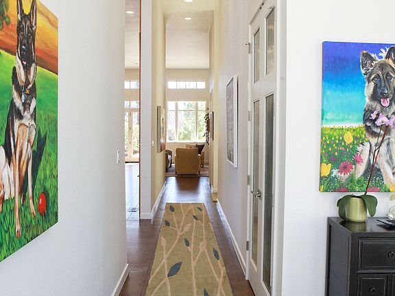 Upon entering the home, you are greeted with soaring 14ft ceilings.