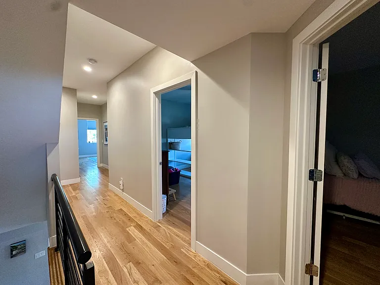 Hallway facing all three second floor bedrooms.
