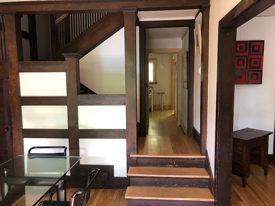 Stairs to upper floor and hall to kitchen which overlooks back garden.