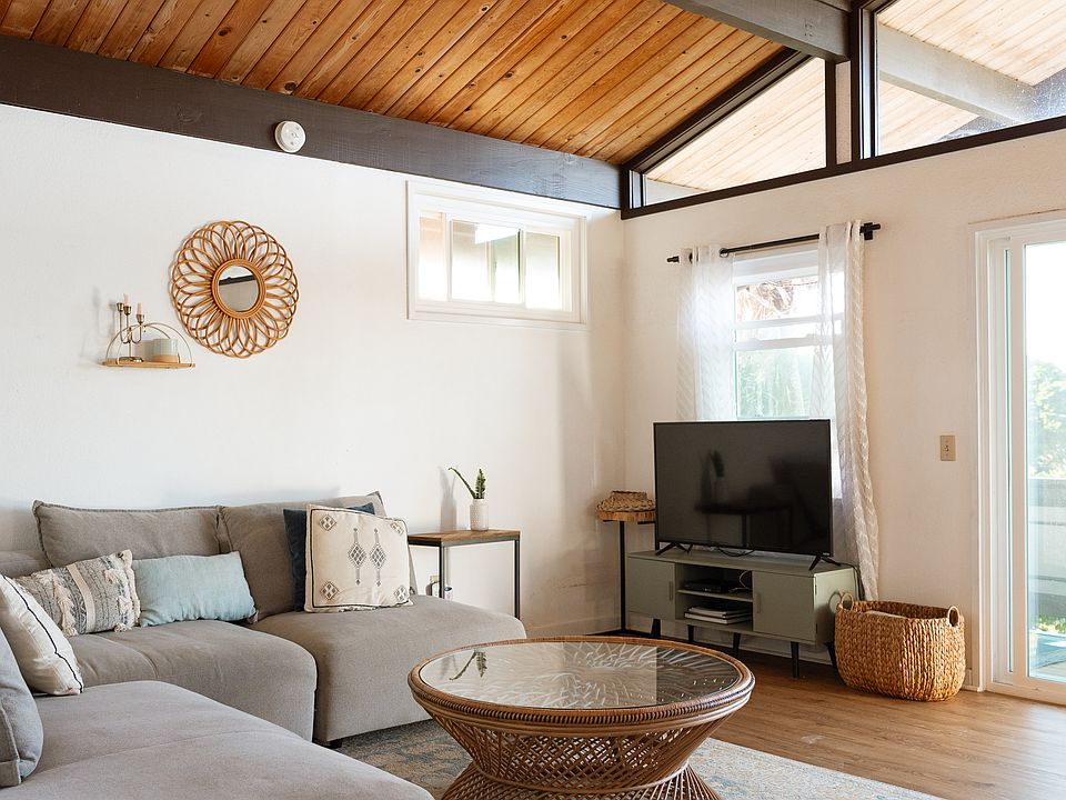 Vaulted ceiling breezy living room.
