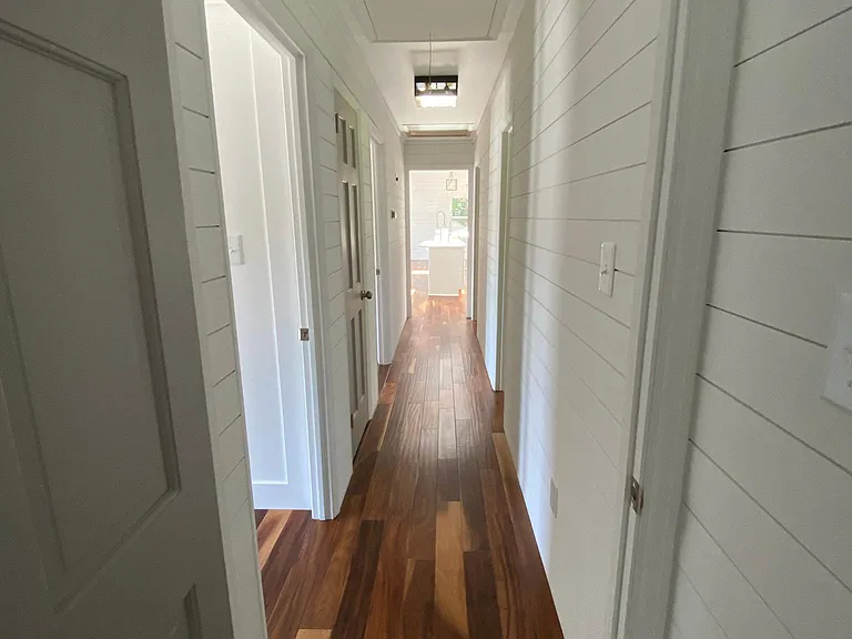 Hallway. Entire House is Ship lapped.