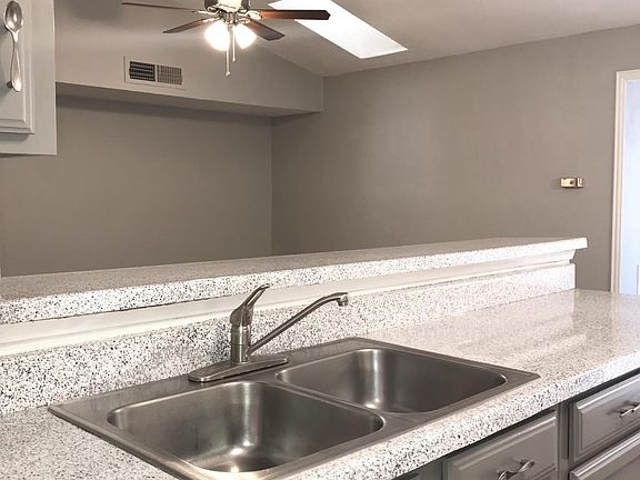 Living Room W/Vaulted Ceiling & Skylight