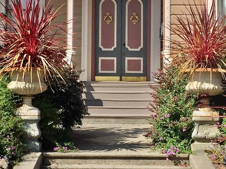Antique French pots welcome you to the entrance.