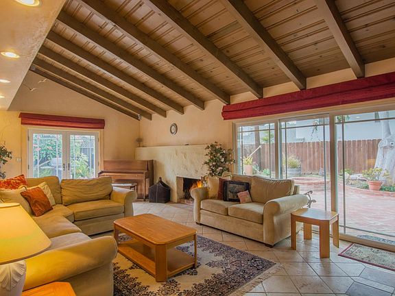 Living room with vaulted wood ceiling