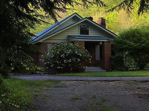 Front of house with driveway.