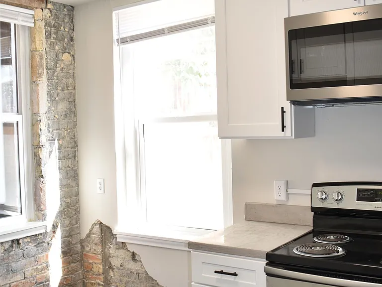 Black luxury vinyl tile gives this space a sophisticated feel.