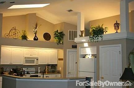 Kitchen w/ Skylight
						:
						Extra Lg Laundry Room Seen in Back; Pantry Next to Refrigerator