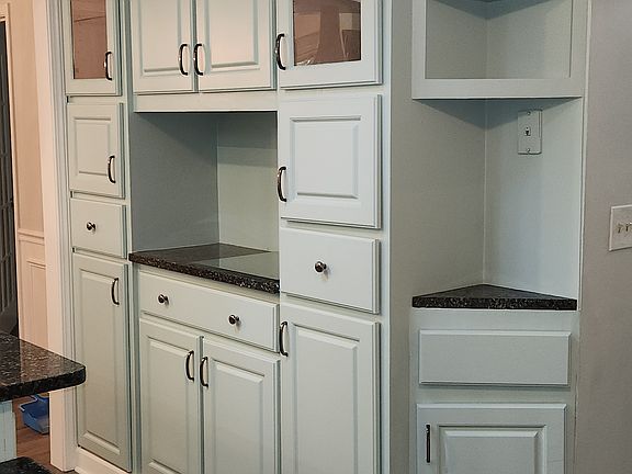 Ample kitchen storage with lighted display areas.