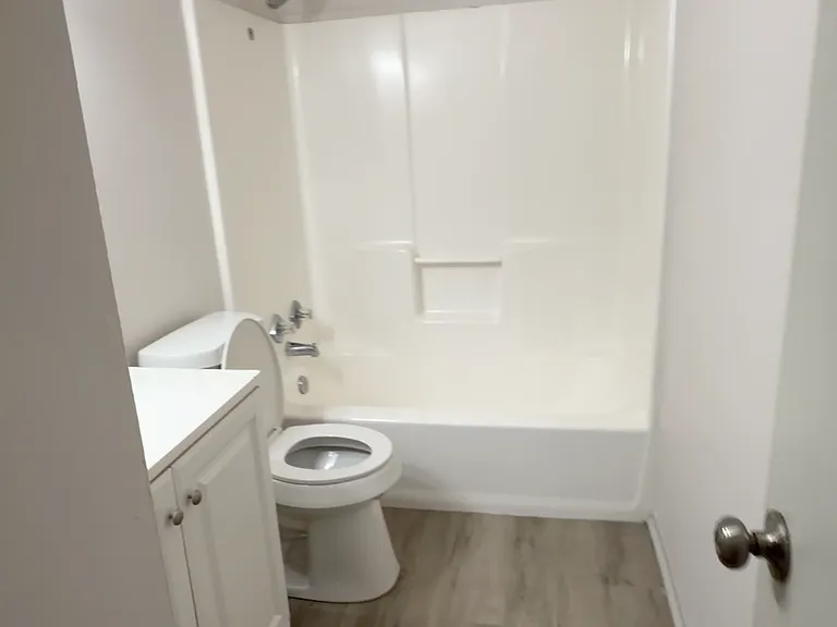 Clean, updated bathroom featuring a modern vanity, fresh fixtures, and a full tub/shower combo.