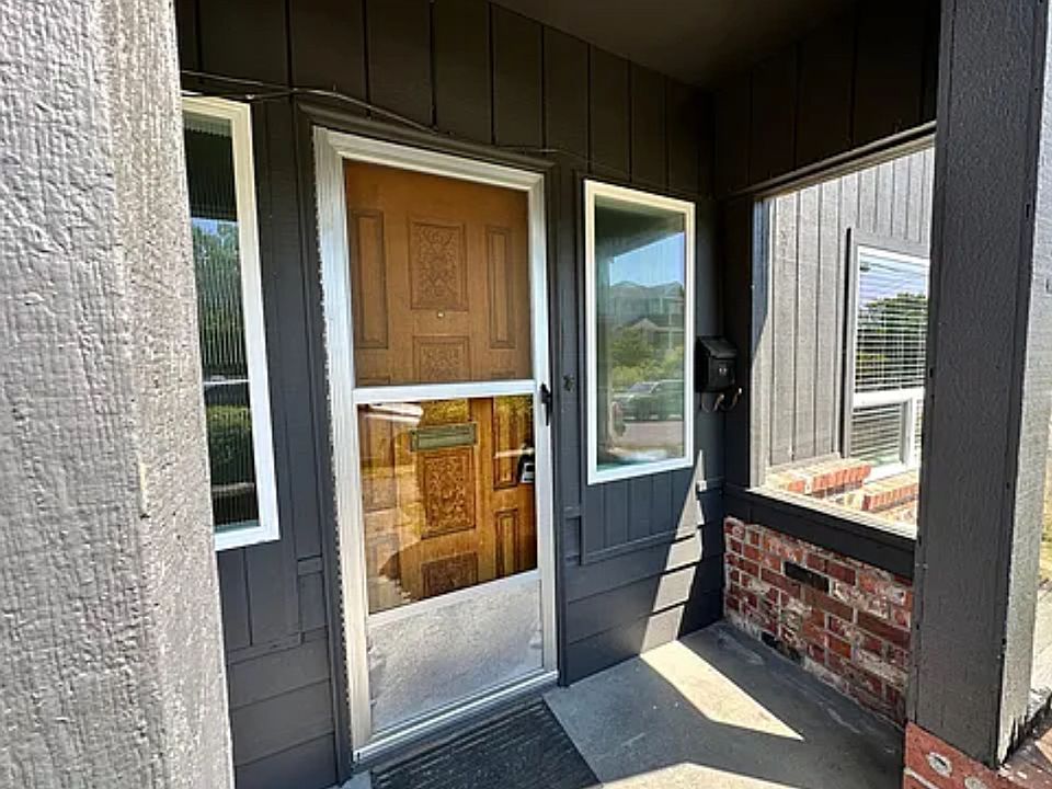 Front door and covered porch with screen door to let fresh air in.