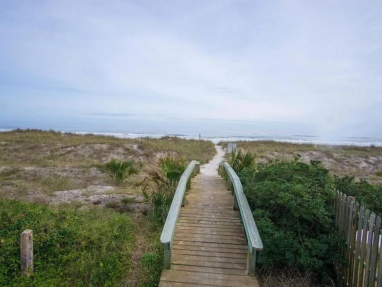 Walkway to common beach entrance located next to townhome