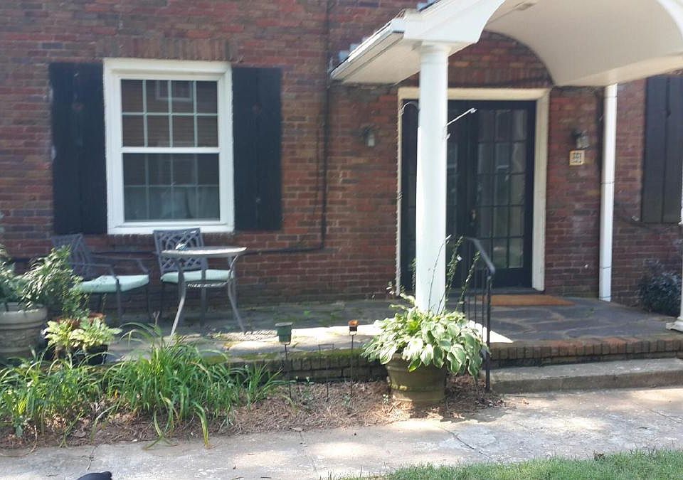 Front of building. Shared front porch.