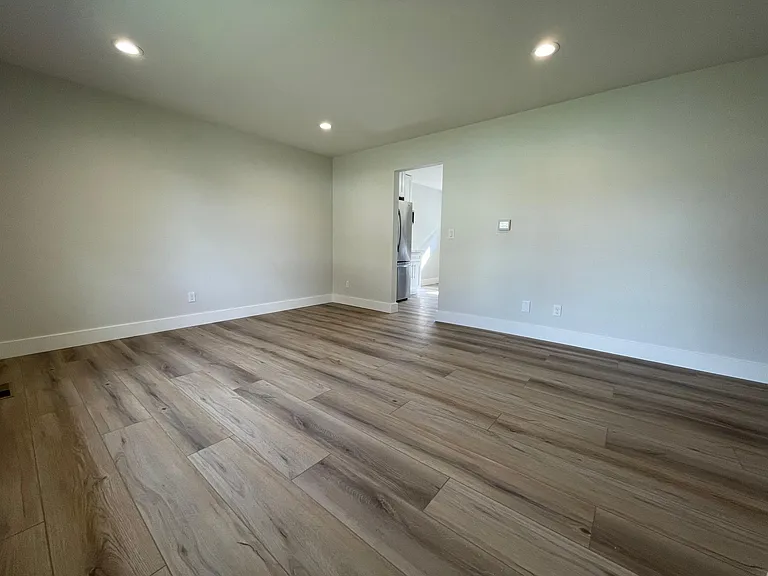 Unit 413 has refinished hardwood flooring rather than LVT like this unit 417