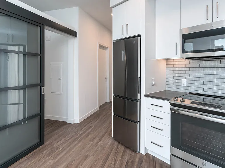 Kitchen with Quartz Countertops and Stainless Steel Appliances