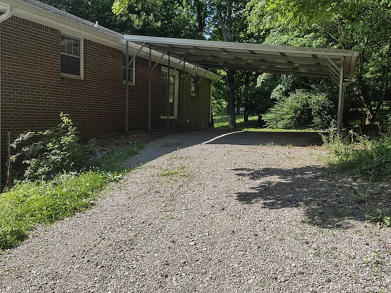 Back yard with carport off kitchen