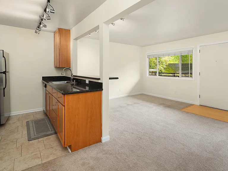 Pic from dining area with kitchen and living room in view