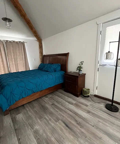 large bedroom with California King bed.