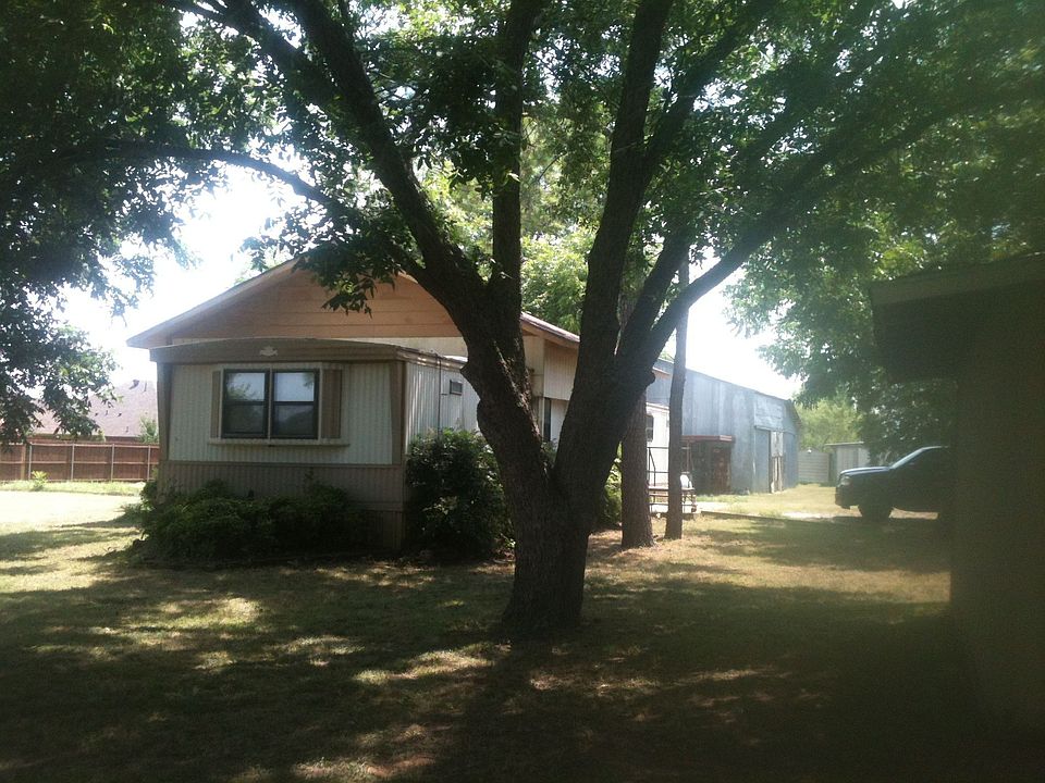 side view under tall trees