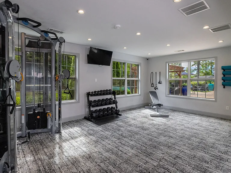 Unleash your strength with comprehensive weight training equipment in our fitness center.