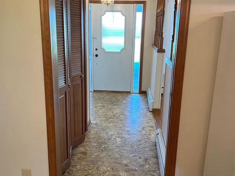 Entry hall with large coat closet on left.