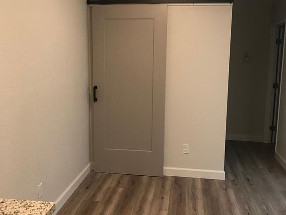 Dining area and pantry with sliding door panel