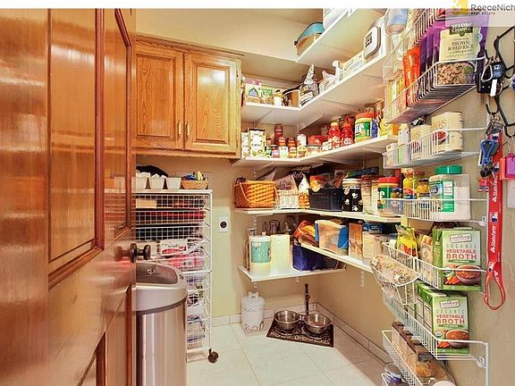 Walk In Pantry.  Can easily be converted to Laundry Room. Tile floors & so much storage