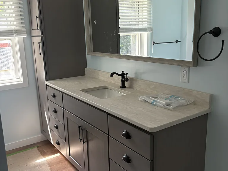 Bathroom vanity with double drawers and built in linen closet