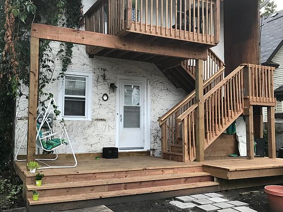 New back deck offers separate outdoor spaces for both tenants.