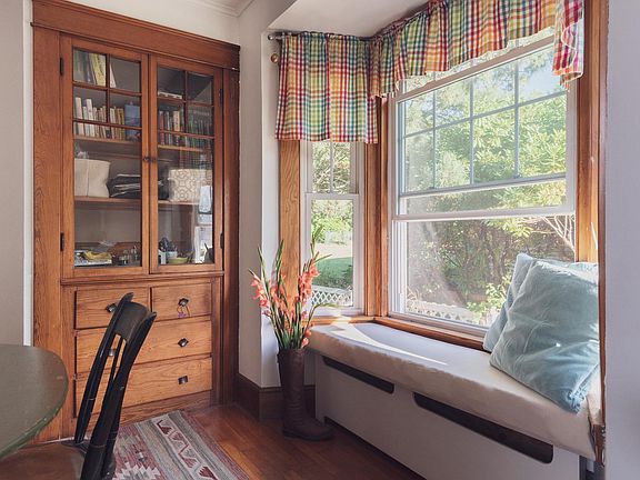 built-in cabinets and sunny window bench