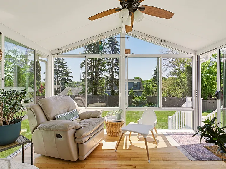 Sun room with morning to early afternoon sun, heat and AC.