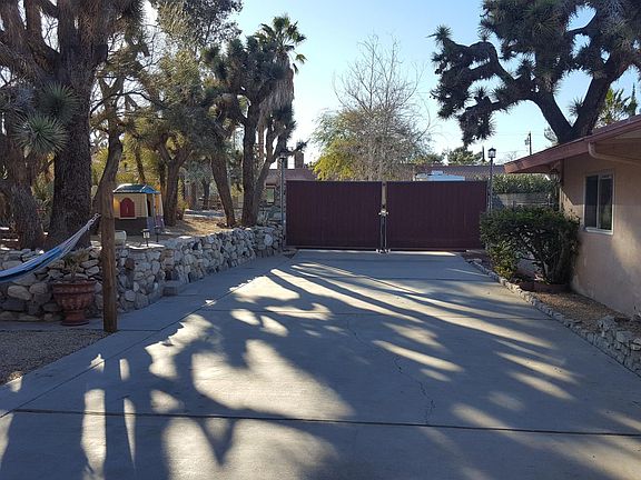 Back driveway with great big double gates