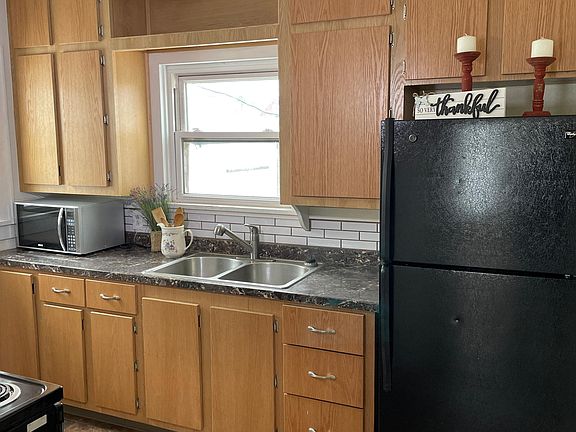 Kitchen - with refrigerator and microwave.