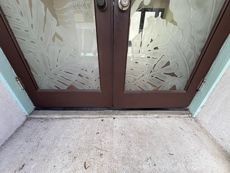 custom glass detail on the right entry doors.