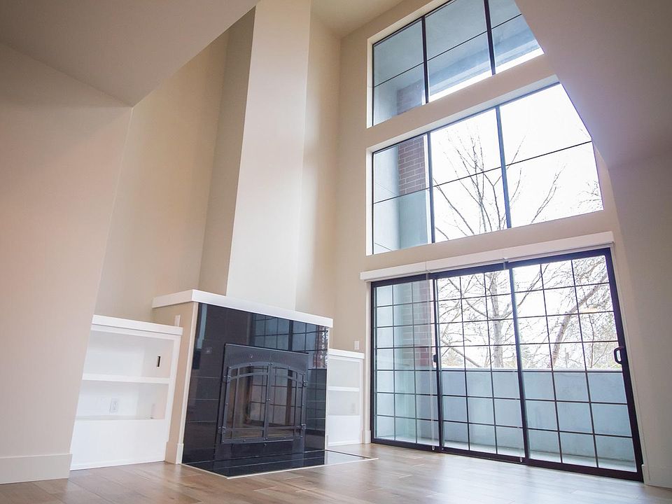 Downstairs kitchen & living with beautiful windows and natural light.