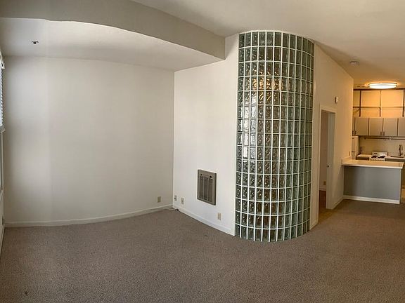 Unfurnished view of the main living space and kitchen.