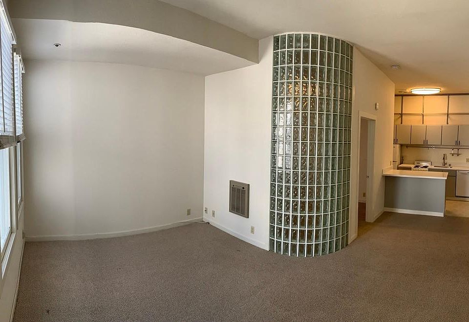 Unfurnished view of the main living space and kitchen.