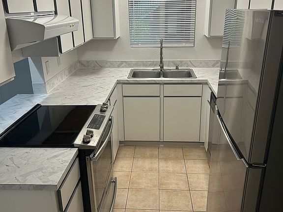 Galley Style Kitchen with all Stainless Steel Appliances