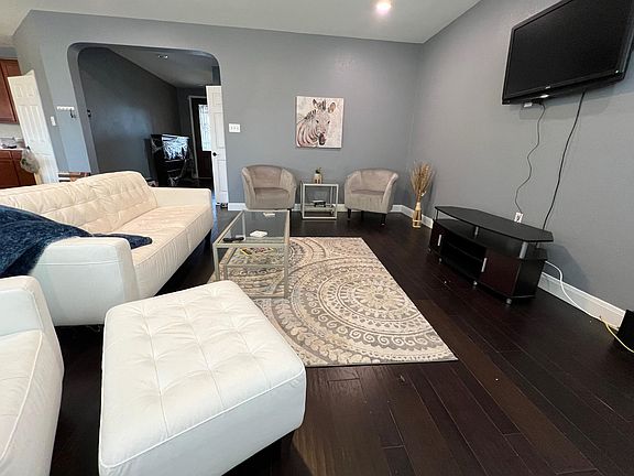 living area open to kitchen and dining